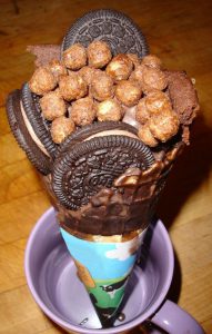 Cocoa puffs, chocolate filled Oreos, fudge brownie, chocolate ice cream, hand dipped waffle cone