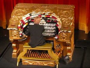 The gold Wurlitzer organ in use